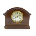 An early 20thC mantle clock / timepiece, the mahogany case with inlaid decoration. Approx 11 1/2"
