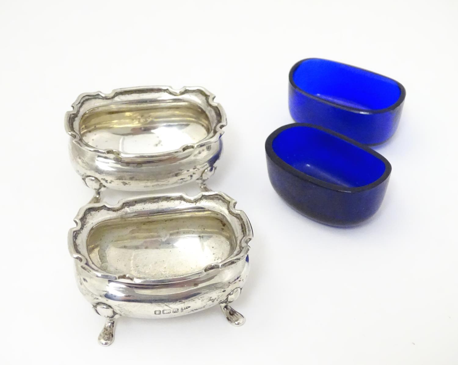 A pair of silver salts with blue glass liners, hallmarked Sheffield 1908 maker Walker & Hall. 2 1/2" - Image 7 of 7