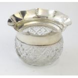 A cut glass bowl with flared silver rim hallmarked Birmingham 1903 maker George Nathan & Ridley