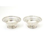A pair of silver pedestal bonbon dishes with pierced decoration. Hallmarked London 1966 maker A.