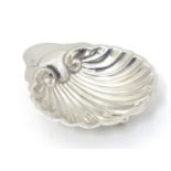 A silver butter dish of shell form, hallmarked Sheffield 1901 maker James Deakin & Sons (John &