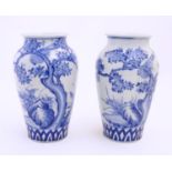 Two Chinese blue and white vases decorated with landscape scene with birds and trees. Approx. 9 3/4"