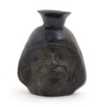 An unusual Inca blackware / Chimu style pottery vase modelled as a face. Approx. 6 1/2" high
