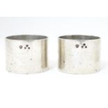 A pair of Victorian silver napkin rings, hallmarked London 1899, maker Edward Barnard & Sons Ltd. (