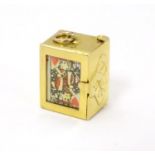 A 9ct gold charm containing a miniature deck of cards 3/4" high Please Note - we do not make