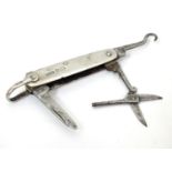 A silver handled pocket knife with folding knife, scissors and button hook sections Hallmarked