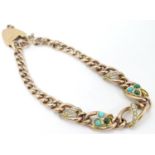 A 9ct gold bracelet set with seed pearl and turquoise in a shamrock setting Please Note - we do