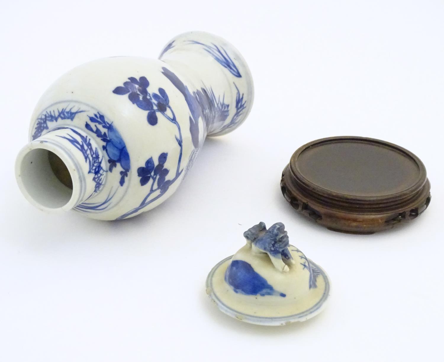 A Chinese blue and white vase and cover with floral, foliate and bird detail. The lid with foo dog - Image 7 of 7