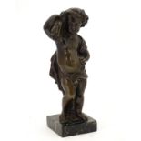 A late 19thC cast bronze figure of a cherub representing Autumn, holding a sheaf of wheat over his