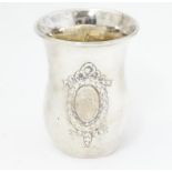 A mid 19thC Austrian Empire silver beaker with laurel chaplet and bow decoration and a monogram