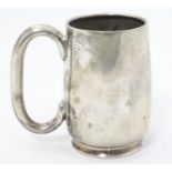 A silver christening mug with loop handle. Hallmarked Birmingham 1918 maker Wilmot Manufacturing Co.