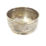 A silver bowl with banded Arts and Crafts / Celtic style decoration. Hallmarked Sheffield 1926 maker