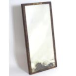 A mid 19thC mahogany mirror with applied gilt mounts. 46" high x 23" wide. Please Note - we do not
