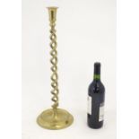 An early 20thC brass candlestick with open twist column. Approx. 20 3/4" high Please Note - we do