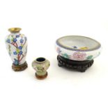 Three Oriental cloisonne items comprising a bowl with floral decoration, a vase with blossom detail