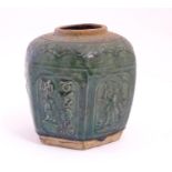 A Chinese hexagonal Shiwan ginger jar / vase with moulded floral, foliate, bird and script detail