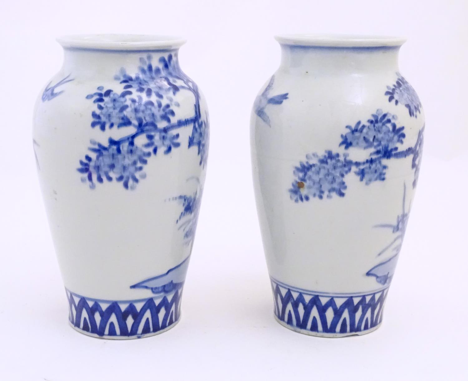 Two Chinese blue and white vases decorated with landscape scene with birds and trees. Approx. 9 3/4" - Image 5 of 6