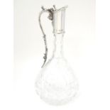 A Silver mounted cut glass claret jug / ewer with fruiting vine decoration. Hallmarked Birmingham