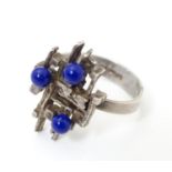 A late 20thC silver ring with modernist decoration. Ring size approx J 1/2 Please Note - we do not