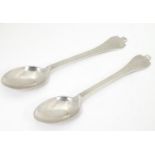A pair of silver teaspoons with dog nose style handles, hallmarked Sheffield 1933, maker C. W
