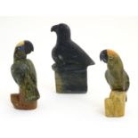 Three Oriental carved soapstone models of birds, comprising two parrots on stylised branches,