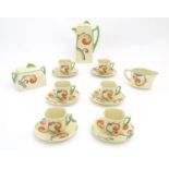 A Royal Doulton Art Deco coffee set in the pattern Syren with scrolling foliate detail, comprising a