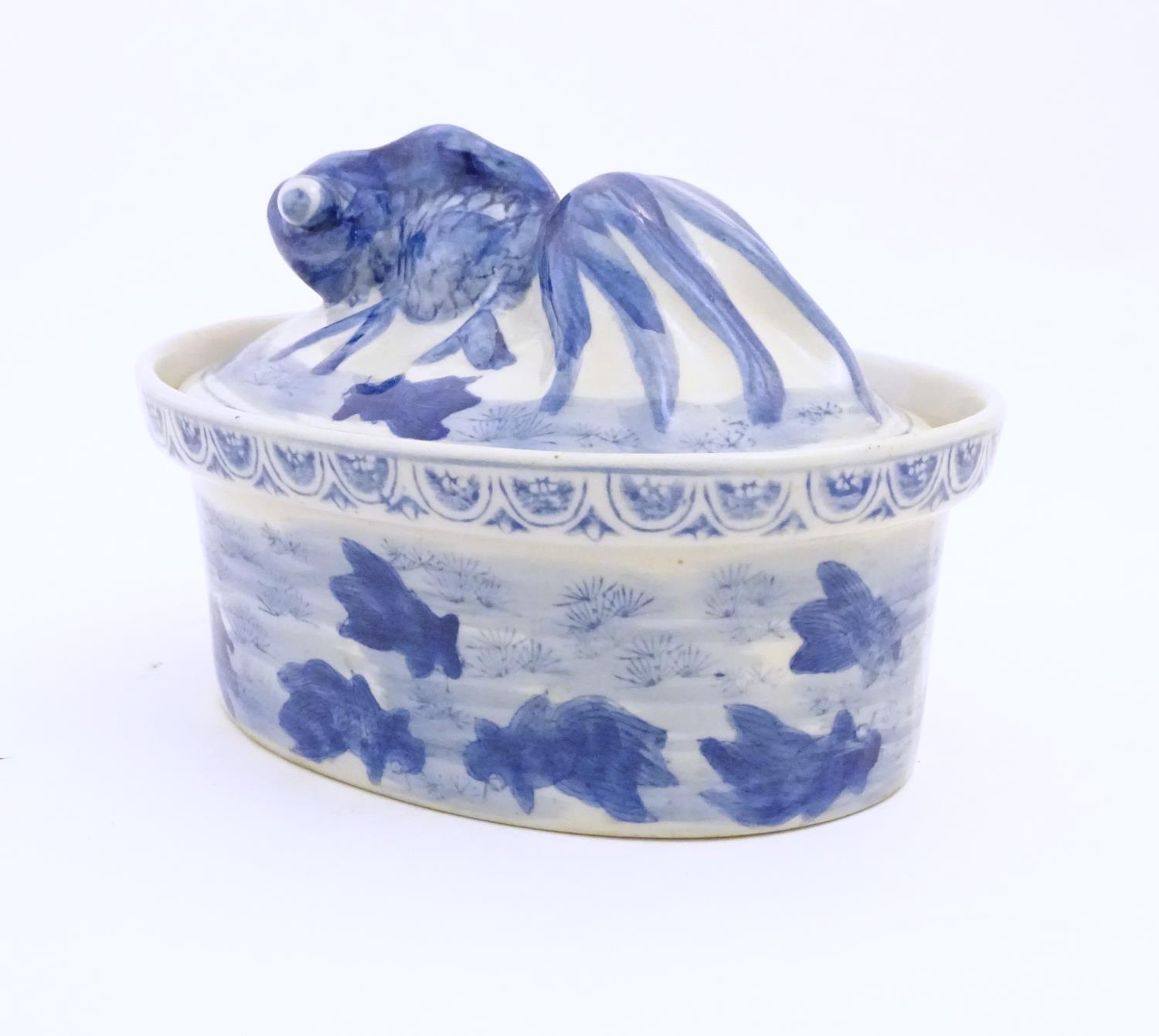 A Chinese blue and white dish and cover of oval form, the lid surmounted by a fish in relief, the - Image 4 of 6