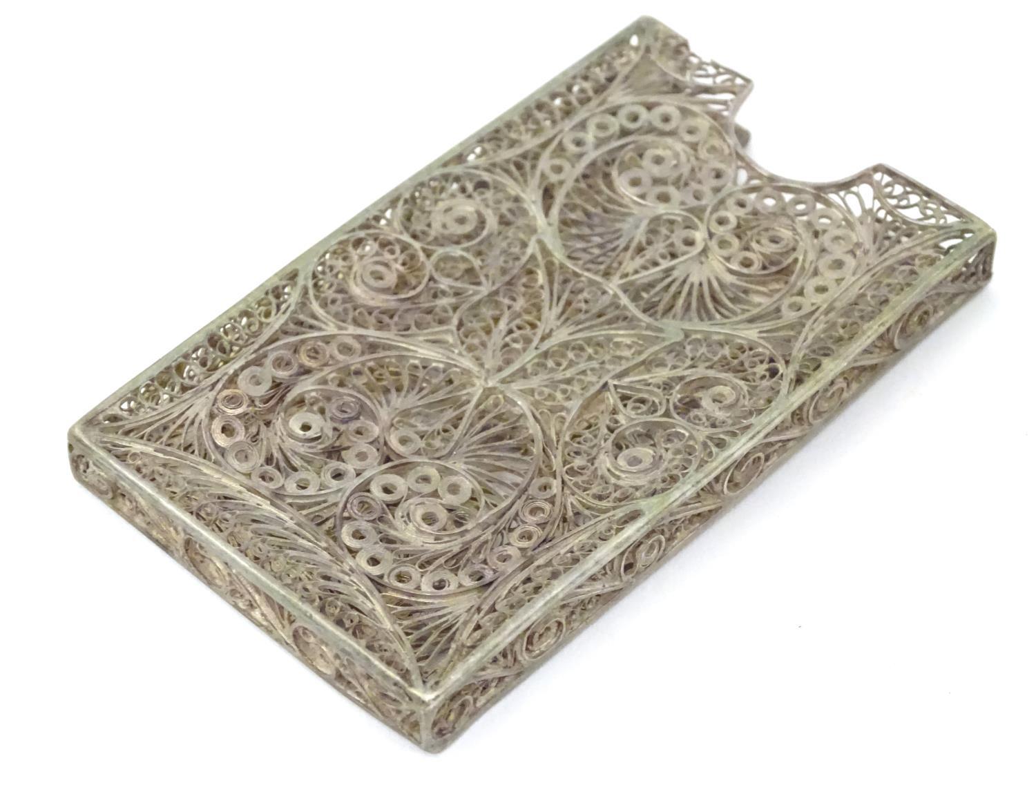 A white metal card vase with filigree decoration . 3" long Please Note - we do not make reference to - Image 3 of 6