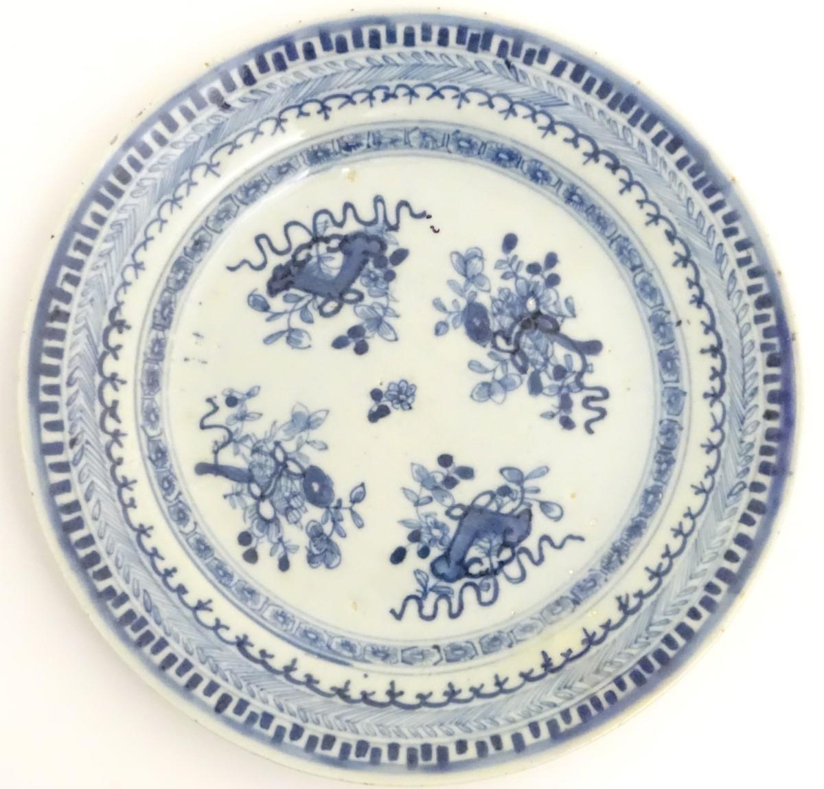 An 18thC Chinese blue and white plate decorated with Daoist emblems, and banded patterned borders. - Image 8 of 8