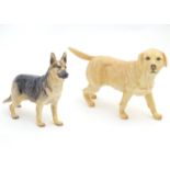 Two Royal Doulton models of dogs comprising a Golden Labrador, and an Alsatian, no. HN 1117.