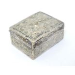A white metal box with stylised big cat decoration. Probably Indian. 1 3/4" wide Please Note - we do