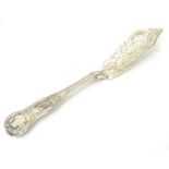 A Victorian silver Kings Pattern butter knife with engraved decoration. Hallmarked London 1847 maker