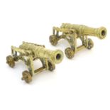 Militaria: a pair of early 20thC cast brass model desk cannons, each 8 1/4" long, 4" tall Please