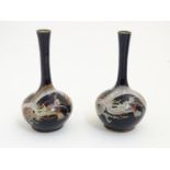 A pair of Oriental cloisonne vases with elongated necks decorated with dragons. Approx. 6" high (