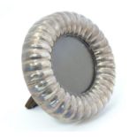 A Continental silver photograph frame of circular form Approx. 4 3/4" diameter overall. Please