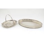 A silver plated oval tray with galleried side together with a cake basket with swing over handle.