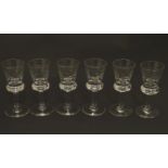 A set of six crystal sherry glasses formed as thistles, with cut roundel decoration, each 4 1/8"