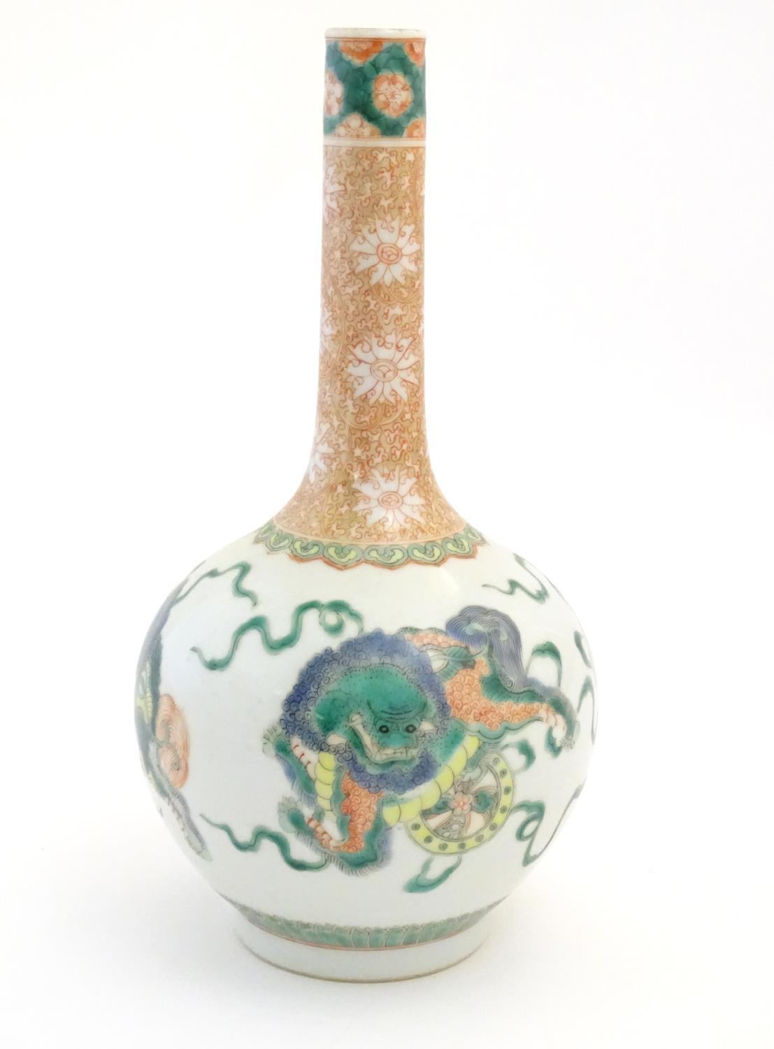 A Chinese bottle vase decorated with stylised foo dogs / dragons. The neck with floral and foliate - Image 3 of 7