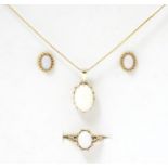 A 9ct gold opal jewellery comprising necklace earrings and rings set with opal cabochon. Please Note