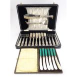 A cased 6-place set of silver handled fish eaters with servers. The handles hallmarked Sheffield