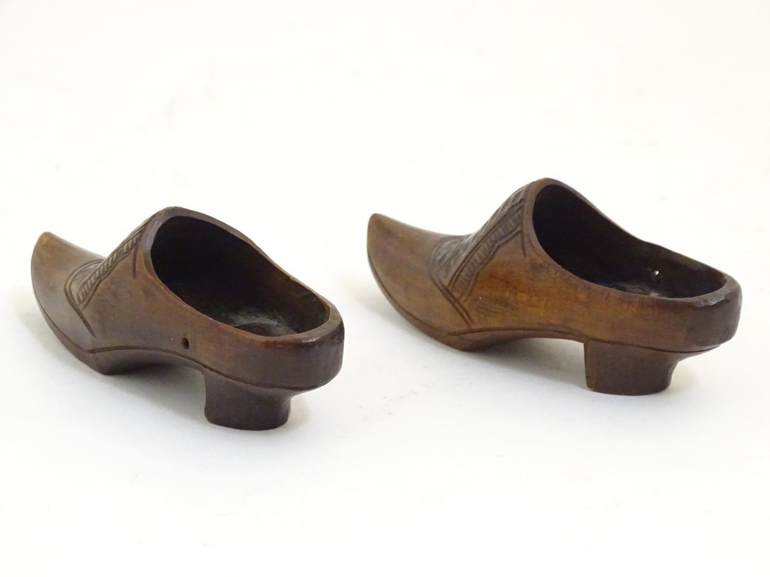 A pair of 20thC carved miniature clogs. Approx. 3 3/4" long (2) Please Note - we do not make - Image 6 of 6