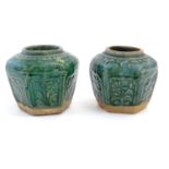 Two Chinese hexagonal Shiwan ginger jars / vases with moulded floral and foliate detail with a