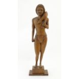 A 20thC wooden carving depicting a male hunter carrying a deer. Approx. 18 3/4" high Please Note -