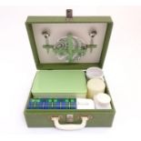 A mid 20thC picnic set with thermos flask, Brexton container and etc. The case 12" x 5" x 10" Please