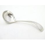 A silver sauce ladle. Hallmarked Sheffield 1937 maker Viners Ltd. Approx. 5" long. Please Note -