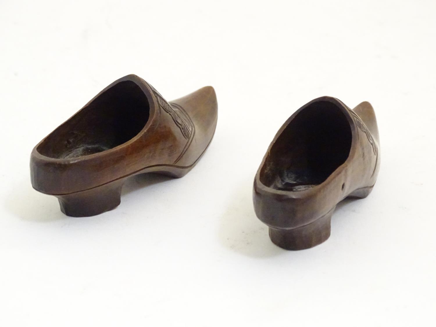 A pair of 20thC carved miniature clogs. Approx. 3 3/4" long (2) Please Note - we do not make - Image 5 of 6