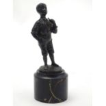 A 20thC cast figure of a negro boy smoking a pipe. Signed R. Moret. On a marble base. Approx. 5 1/2"