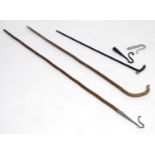 An assortment of early 20thC shepherd's crooks, comprising a leg cleek stick, with hazel shank and