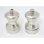 Mid to late 20thC salt and pepper mills / grinders, marked under Peter Piper. Approx. 2 3/4" high (
