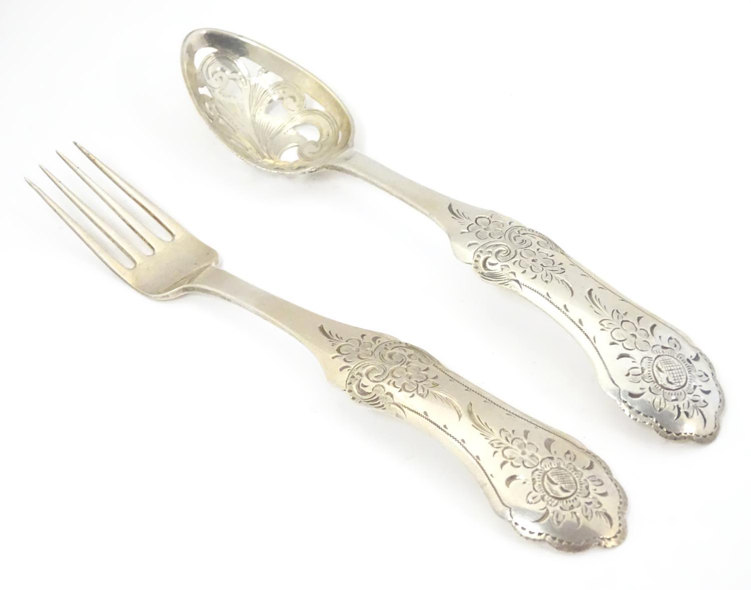 A 19thC Dutch silver spoon with pierced detail to bowl and fork with engraved decoration to handles.